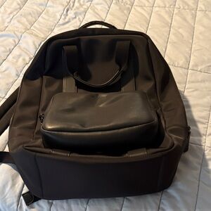 Woman’s Black Backpack, detachable pouch, and a computer pocket.